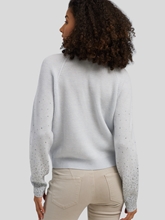 Bild von Strickjacke mit Strasssteinen